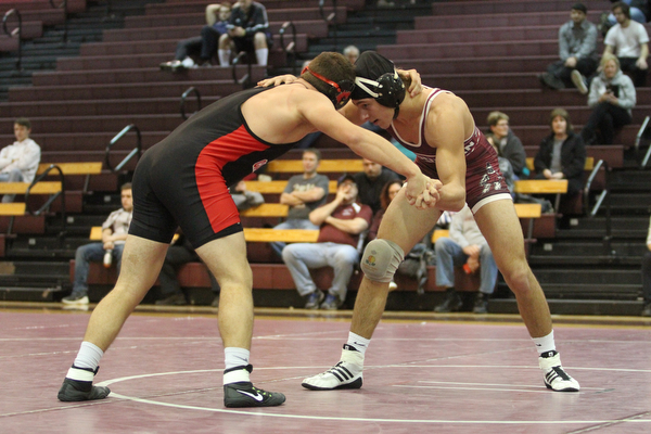 Canfield 170 pound wrestler Nick Crawford(Black) and .Boardman 170 pound wrestler Michael O'Horo(red) lock heads as Boardman High School Takes on Canfield High School at the Boardman High School Gymnasium  in Boardman on Wednesday, Jan. 11, 2017. ..(Nikos Frazier | The Vindicator)..