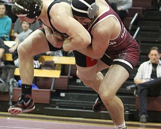 Canfield 195 pound wrestler Tyler Stein(Black) is slammed to the mat by Boardman 195 pound wrestler Alex King(red) as Boardman High School Takes on Canfield High School at the Boardman High School Gymnasium  in Boardman on Wednesday, Jan. 11, 2017. ..(Nikos Frazier | The Vindicator)..