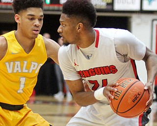 William D. Lewis The Vindicator YSU'sCameron Morse(24) drives past Valpo's Micah Bradford(1) during Jan 12 , 2017 action at YSU.