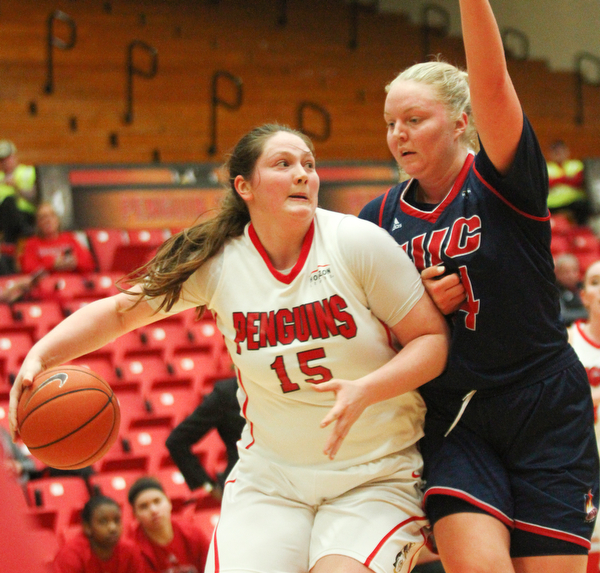 William D. Lewis The Vindicator YSU's Mary Dunn(15) drives aroud UIC's Tyra Carlsten - Handberg(14) during Jan 12 , 2017 action at YSU.