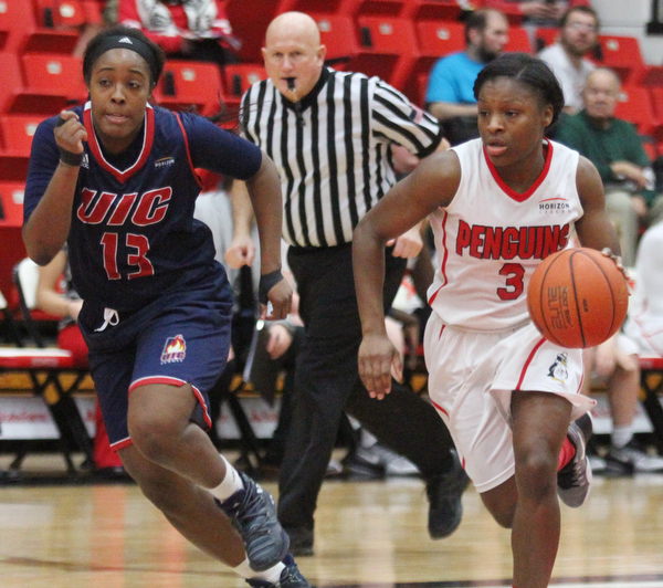 William D. Lewis The Vindicator YSU's Indiya Benjamin(3) drives aroud UIC's Kiki Bynes(13) during Jan 12 , 2017 action at YSU.
