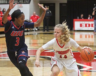William D. Lewis The Vindicator YSU's Maelinda Trimmer(14) drives around UIC'sBrittany Byrd(3) during Jan 12 , 2017 action at YSU.