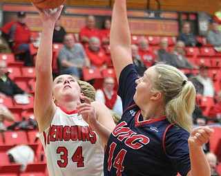 William D. Lewis The Vindicator YSU's Morgan Brunner(34) shoots around UIC's Tyra Carlsten - Handberg(14) during Jan 12 , 2017 action at YSU.
