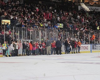 Neighbors | Alexis Bartolomucci.Students went on the ice during an intermission to help with the Chuck a Puck game at a Youngstown Phantoms Get Schooled game on Dec. 8.