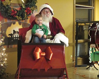Neighbors | Alexis Bartolomucci.Connor sat on Santa's lap for a picture during the Supper with Santa event on Dec. 8 at Boardman Park.