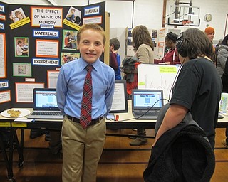 Neighbors | Alexis Bartolomucci.Matthew Beichner did his science experiment on the effect of music on memory for the fourth-grade science fair at West Boulevard Elementary on Dec. 8.