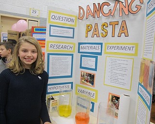 Neighbors | Alexis Bartolomucci.Isabel Klisiewicz did her science experiment on dancing pasta for the annual fourth-grade science fair on Dec. 8 at West Boulevard.