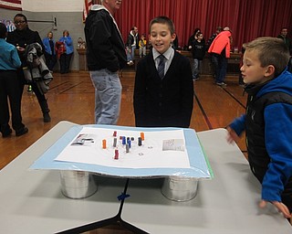 Neighbors | Alexis Bartolomucci.One of the fourth-grade students at West Boulevard showed off his earthquake science experiment on Dec. 8 at the annual science fair.