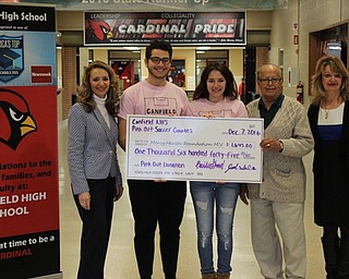 Neighbors | Abby Slanker.Canfield High School seniors and varsity soccer players Jad Saleh and Cecilia Shaer presented a check for $1,645 to Rashid Abdu, M.D. on Dec. 7 with the funds which were raised at the Soccer Pink Outs on Oct. 8. Joining them were Gina Marinelli (left) of Mercy Health Foundation of Mahoning Valley and Juli Dulay (right) manager of The Joanie Abdu Comprehensive Breast Care Center at St. Elizabeth’s.