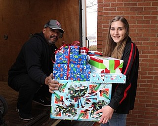 Neighbors | Abby Slanker.Canfield High School sophomore Clare Crescimanno and Salvation Army truck driver Mark Young loaded toys donated from the school through the Salvation Army Angel Tag Drive on a truck destined for the distribution center on Dec. 7.
