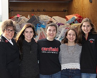 Neighbors | Abby Slanker.Major Valerie Kahn of the Salvation Army (left) visited Canfield High School to accept the donated 325 items for the Salvation Army Angel Tag Drive and thanked, from second left, senior Sydney Stewart, senior Kate Hartshorn, junior Melissa Dahman and sophomore Clare Crescimanno for all their hard work on the campaign on Dec. 7.