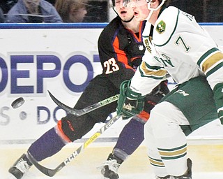 William D Lewis/The Vindicator  Phantoms Alex Esposito(23) shoots past Musketeers Matt Hellickson(7) during Jan. 13, 2017 action at Covelli.