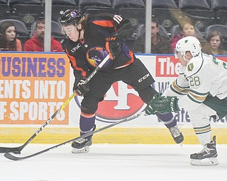 William D Lewis/The Vindicator  Phantoms Marshall Moise(10) shoots past Musketeers Carson Vance(28) during Jan. 13, 2017 action at Covelli.