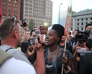 Nikos Frazier | The Vindicator..Two protestors argue in Cleveland's Public Square on the fourth and final day of the Republican National Convention.