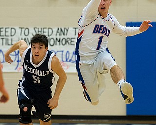 MICHAEL G TAYLOR | THE VINDICATOR- 01-13-17 -  Basketball -1st qtr, Reserve's #1 Wyatt Larimerhas the ball knocked out of hands by Mcdonald's #5 Josh Celli. Mcdonald Blue Devils vs Western Reserve Blue Devils Western Reserve Springfield High School in Berlin Center Western Reserve, OH.