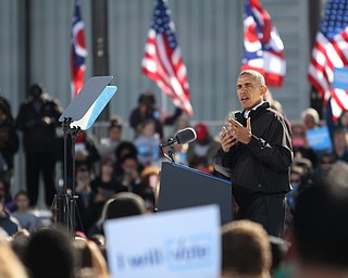 Nikos Frazier | The Vindicator..President Barack Obama speaks at a campaign rally for Democratic presidential candidate Hillary Clinton on Friday, Oct. 14, 2016 at the Cleveland Burke Lakefront Airport in Cleveland, Ohio.