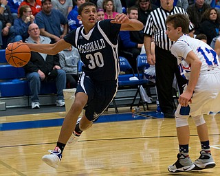 MICHAEL G TAYLOR | THE VINDICATOR- 01-13-17 -  Basketball -2nd qtr, Mcdonald's #30 Braedon Poole drives to the hoop against Reserve's #12 Riley Miller. Mcdonald Blue Devils vs Western Reserve Blue Devils Western Reserve Springfield High School in Berlin Center Western Reserve, OH