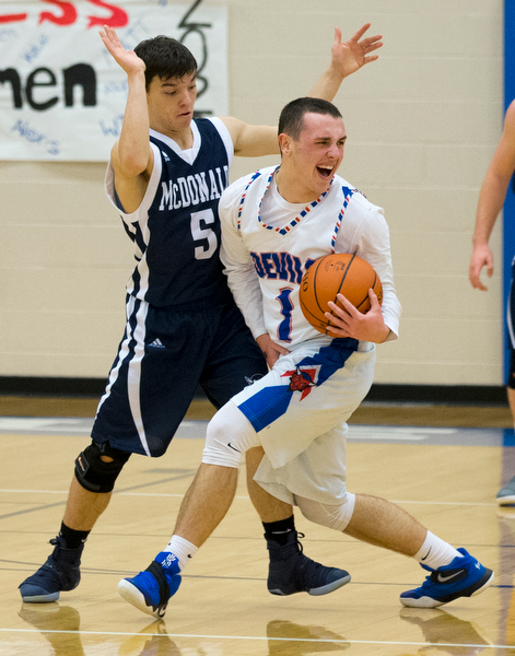 MICHAEL G TAYLOR | THE VINDICATOR- 01-13-17 -  Basketball -2nd qtr, Mcdonald's #5 Josh Celli defends against Reserve's #1 Wyatt Larimer. Mcdonald Blue Devils vs Western Reserve Blue Devils Western Reserve Springfield High School in Berlin Center Western Reserve, OH
