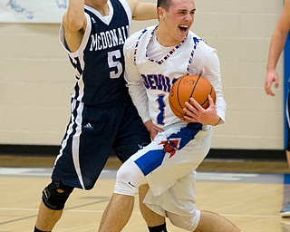 MICHAEL G TAYLOR | THE VINDICATOR- 01-13-17 -  Basketball -2nd qtr, Mcdonald's #5 Josh Celli defends against Reserve's #1 Wyatt Larimer. Mcdonald Blue Devils vs Western Reserve Blue Devils Western Reserve Springfield High School in Berlin Center Western Reserve, OH