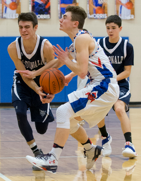 MICHAEL G TAYLOR | THE VINDICATOR- 01-13-17 -  Basketball -4th qtr, Mcdonald's #11 Calab Emerson and  Reserve's #23 Cole DeZee go for the loose ball. Mcdonald Blue Devils vs Western Reserve Blue Devils Western Reserve Springfield High School in Berlin Center Western Reserve, OH