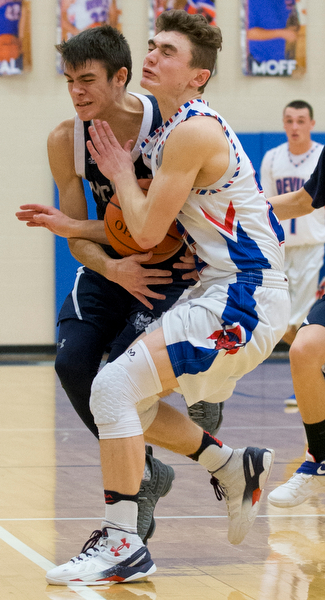 MICHAEL G TAYLOR | THE VINDICATOR- 01-13-17 -  Basketball -4th qtr, Mcdonald's #11 Calab Emerson and  Reserve's #23 Cole DeZee go for the loose ball. Mcdonald Blue Devils vs Western Reserve Blue Devils Western Reserve Springfield High School in Berlin Center Western Reserve, OH