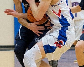 MICHAEL G TAYLOR | THE VINDICATOR- 01-13-17 -  Basketball -4th qtr, Mcdonald's #11 Calab Emerson and  Reserve's #23 Cole DeZee go for the loose ball. Mcdonald Blue Devils vs Western Reserve Blue Devils Western Reserve Springfield High School in Berlin Center Western Reserve, OH