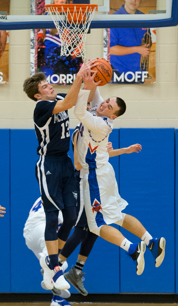 MICHAEL G TAYLOR | THE VINDICATOR- 01-13-17 -  Basketball - 4th qtr, Mcdonald's #13 Dylan Portolese and Reserve's #1 Wyatt Larimer battle for the rebound as time expiresl. Mcdonald Blue Devils vs Western Reserve Blue Devils Western Reserve Springfield High School in Berlin Center Western Reserve, OH