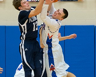 MICHAEL G TAYLOR | THE VINDICATOR- 01-13-17 -  Basketball - 4th qtr, Mcdonald's #13 Dylan Portolese and Reserve's #1 Wyatt Larimer battle for the rebound as time expiresl. Mcdonald Blue Devils vs Western Reserve Blue Devils Western Reserve Springfield High School in Berlin Center Western Reserve, OH