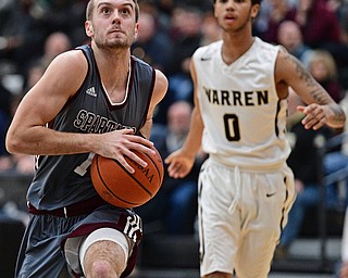 WARREN, OHIO - JANUARY 13, 2017: John Ryan #1 of Boardman goes to the basket after getting past Tiryn Frank #0 of Harding during the first half of their game Friday night at Warren Harding High School. DAVID DERMER | THE VINDICATOR