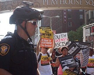 Nikos Frazier | The Vindicator..Protestors march down Euclid Ave. under the watchful eye of Cleveland Police and Fort Worth Police.