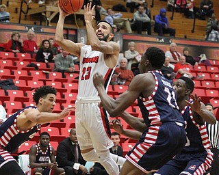 Youngstown State junior guard Francisco Santiago(23) goes up for the layup during the first half as the Youngstown State Penguins take on the University of Illinois at Chicago Flames at the Beeghly Center in Youngstown on Saturday, Jan. 14, 2017. UIC won, 92-89 in Overtime...(Nikos Frazier | The Vindicator)..