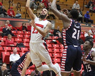 Youngstown State junior guard Francisco Santiago(23) goes up for the layup during the first half as the Youngstown State Penguins take on the University of Illinois at Chicago Flames at the Beeghly Center in Youngstown on Saturday, Jan. 14, 2017. UIC won, 92-89 in Overtime...(Nikos Frazier | The Vindicator)..