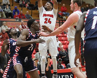 Youngstown State junior guard Cameron Morse(24) goes up for the three during the first half as the Youngstown State Penguins take on the University of Illinois at Chicago Flames at the Beeghly Center in Youngstown on Saturday, Jan. 14, 2017. UIC won, 92-89 in Overtime...(Nikos Frazier | The Vindicator)..