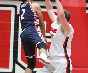 Youngstown State senior center Jorden Kaufman(32) attempts to block University of Illinois at Chicago freshman forward KJ Santos'(2) layup during the first half as the Youngstown State Penguins take on the University of Illinois at Chicago Flames at the Beeghly Center in Youngstown on Saturday, Jan. 14, 2017. UIC won, 92-89 in Overtime...(Nikos Frazier | The Vindicator)..