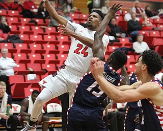 Youngstown State junior guard Cameron Morse(24) goes up for the layup during the first half as the Youngstown State Penguins take on the University of Illinois at Chicago Flames at the Beeghly Center in Youngstown on Saturday, Jan. 14, 2017. UIC won, 92-89 in Overtime...(Nikos Frazier | The Vindicator)..