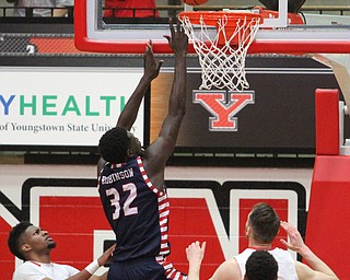University of Illinois at Chicago junior forward Clint Robinson(32) goes up to the backboard for his shot during the first half as the Youngstown State Penguins take on the University of Illinois at Chicago Flames at the Beeghly Center in Youngstown on Saturday, Jan. 14, 2017. UIC won, 92-89 in Overtime...(Nikos Frazier | The Vindicator)..