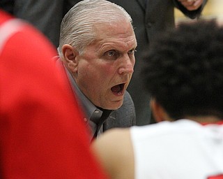 Youngstown State head coach Jerry Slocum talks to his players during a timeout in the second half as the Youngstown State Penguins take on the University of Illinois at Chicago Flames at the Beeghly Center in Youngstown on Saturday, Jan. 14, 2017. UIC won, 92-89 in Overtime...(Nikos Frazier | The Vindicator)..