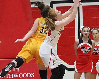 Youngstown State junior guard Kelley Wright(35) fights for the rebound against Valparaiso University junior forward Dani Franklin(32) during the first quarter as the Youngstown State Penguins take on the Valparaiso Crusaders at the Beeghly Center in Youngstown on Saturday, Jan. 14, 2017. Youngstown State won, 76-70...(Nikos Frazier | The Vindicator)..