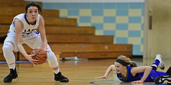 CORTLAND, OHIO - JANUARY 2017: Annie Pavlansky #10 of Lakeview picks up the ball to dribble away from Bella Gajdos #23 of Poland after a scrum for the ball near center court for the loose ball during the first half of their game Saturday afternoon at Lakeview High School. DAVID DERMER | THE VINDICATOR