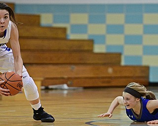 CORTLAND, OHIO - JANUARY 2017: Annie Pavlansky #10 of Lakeview picks up the ball to dribble away from Bella Gajdos #23 of Poland after a scrum for the ball near center court for the loose ball during the first half of their game Saturday afternoon at Lakeview High School. DAVID DERMER | THE VINDICATOR