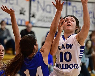 CORTLAND, OHIO - JANUARY 2017: Annie Pavlansky #10 of Lakeview goes to the basket while being guarded by Jillian Penman #14 of Poland during the first half of their game Saturday afternoon at Lakeview High School. DAVID DERMER | THE VINDICATOR