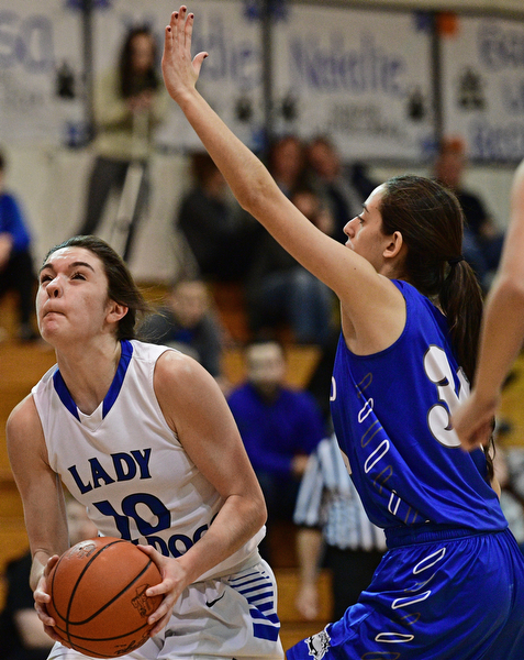CORTLAND, OHIO - JANUARY 2017: Annie Pavlansky #10 of Lakeview goes to the basket while being guarded by Joelle Abi Habib #30 of Poland during the first half of their game Saturday afternoon at Lakeview High School. DAVID DERMER | THE VINDICATOR