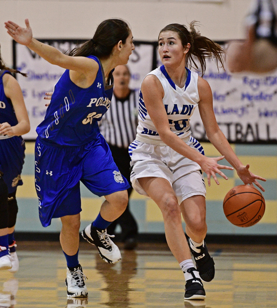 CORTLAND, OHIO - JANUARY 2017: Lindsay Carnahan #20 of Lakeview loses control of the ball while dribbling up court while being pressured by Joelle Abi Habib #30 of Poland during the first half of their game Saturday afternoon at Lakeview High School. DAVID DERMER | THE VINDICATOR