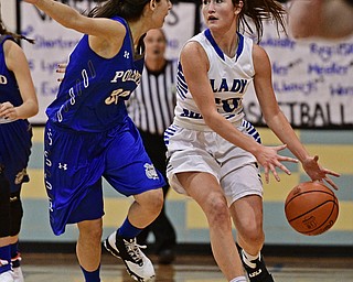 CORTLAND, OHIO - JANUARY 2017: Lindsay Carnahan #20 of Lakeview loses control of the ball while dribbling up court while being pressured by Joelle Abi Habib #30 of Poland during the first half of their game Saturday afternoon at Lakeview High School. DAVID DERMER | THE VINDICATOR