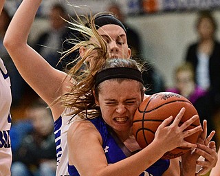 CORTLAND, OHIO - JANUARY 2017: Emily Melnek #42 of Poland attempts to secure the basketball while being pressured from behind by Madison Meeker #11 of Lakeview during the first half of their game Saturday afternoon at Lakeview High School. DAVID DERMER | THE VINDICATOR