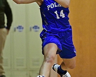 CORTLAND, OHIO - JANUARY 2017: Jillian Penman #14 of Poland flies through the air while keeping the ball from going out of bounds during the first half of their game Saturday afternoon at Lakeview High School. DAVID DERMER | THE VINDICATOR