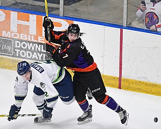 YOUNGSTOWN, OHIO - JANUARY 16, 2017: Eric Esposito #7 of the Phantoms follows through with his check of Jason Smallidge #2 of the Thunder while locating the puck during the second period of their game Monday afternoon at the Covelli Centre. The Phantoms won 4-1. DAVID DERMER | THE VINDICATOR