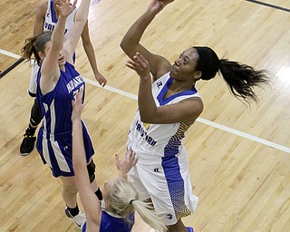 Daisjha Parks (5) of Valley Christian goes up for a shot while being defended by Hubbard's Cassidy Costick (15) and Jasmins Phillips (33) during the first half of Monday nights matchup at Valley Christian School in Youngstown.   Dustin Livesay  |  The Vindicator  1/16/17  Youngstown.