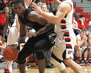 Harding senior Derek Culver(1) tries to dribble closer to the hoop before going up for the shot during the second quarter as Warren G. Harding High School takes on Canfield High School at the Canfield High School Gymnasium in Canfield on Tuesday, Jan. 17, 2017. Harding won, 80-62...(Nikos Frazier | The Vindicator)..