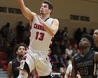 Canfield senior forward Jared Clark(13) goes for the layup during the third quarter as Warren G. Harding High School takes on Canfield High School at the Canfield High School Gymnasium in Canfield on Tuesday, Jan. 17, 2017. Harding won, 80-62...(Nikos Frazier | The Vindicator)..